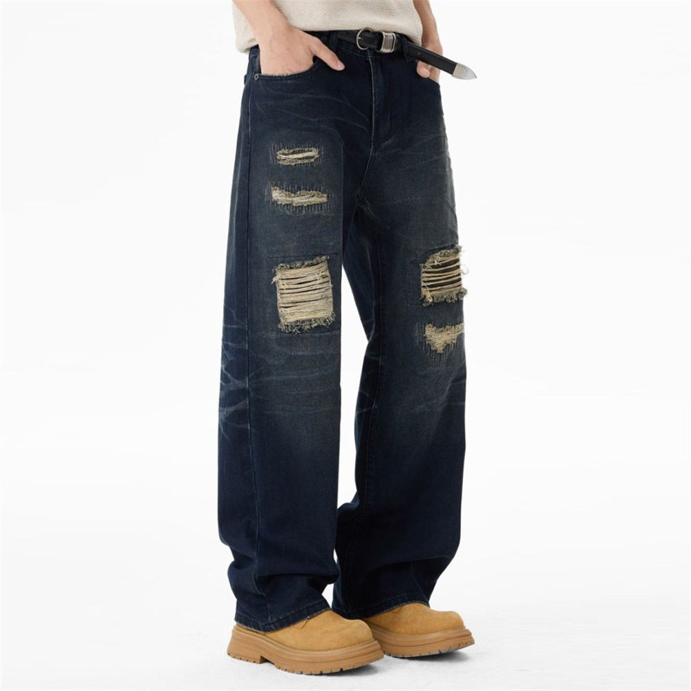 Jean streetwear pour homme avec patchs usés, coupe ample droite délavée style grunge 8
