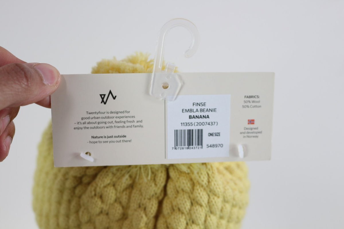 Étiquette cartonnée du bonnet Twentyfour Finse Embla Beanie Banana, composition 50 % laine 50 % coton – Frippin'Dealz