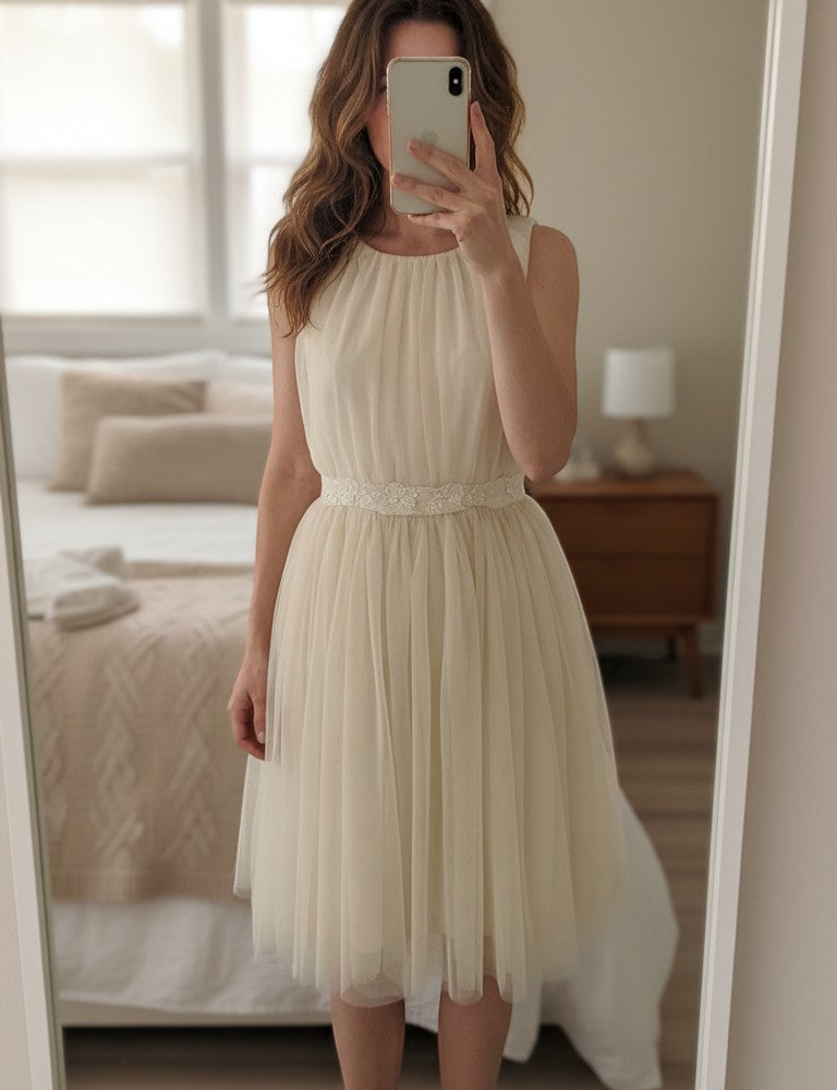 Frippindealz beige nude tulle and polyester blend dress with a flattering waist and ethereal silhouette, perfect for special occasions.