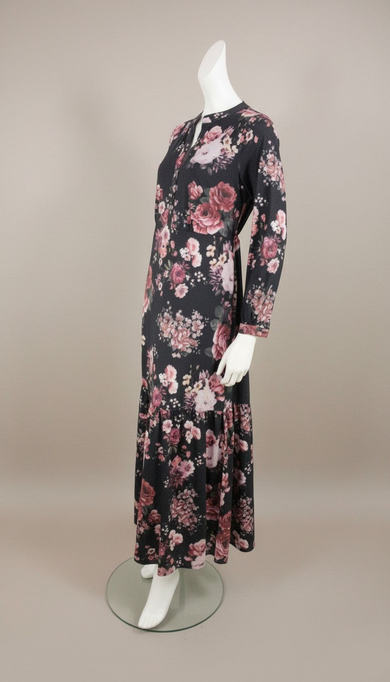 Frippindealz K design black polyester maxi dress with long sleeves and a tiered hem, featuring a bold floral print.