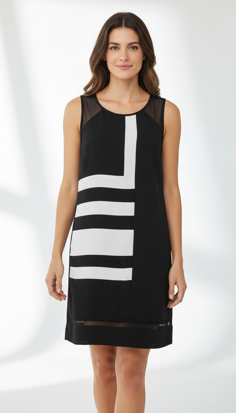 Frippindealz black and white geometric print sleeveless midi dress with sheer neckline and hem detail. Polyester and elastane blend.