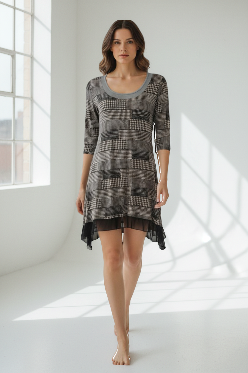 Frippindealz black and white polyester tunic with patchwork houndstooth pattern and sheer hem. Made in France.