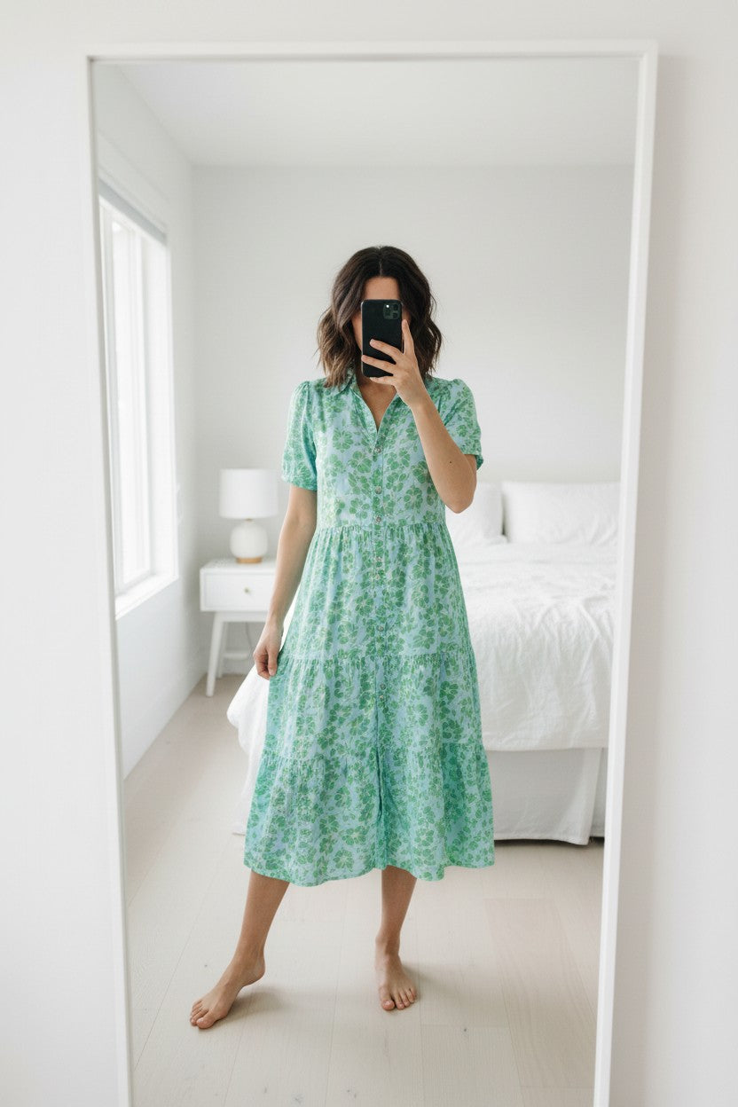 Frippindealz light blue polyester midi dress with green floral print, short sleeves, and tiered skirt.
