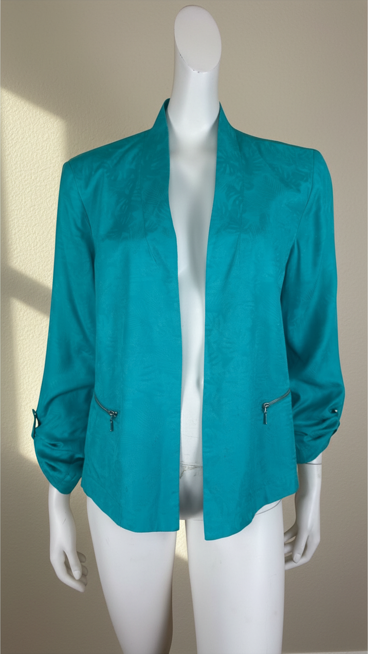 Veste Frippindealz Bréal en viscose vert émeraude avec fermeture zippée sur les poches, présentée sur mannequin