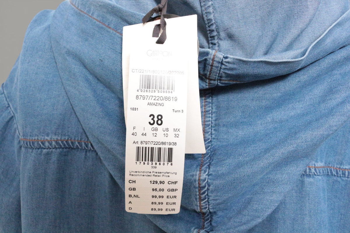 Étiquette de prix sur une chemise en lyocell bleu de la marque Frippindealz avec détails de couture