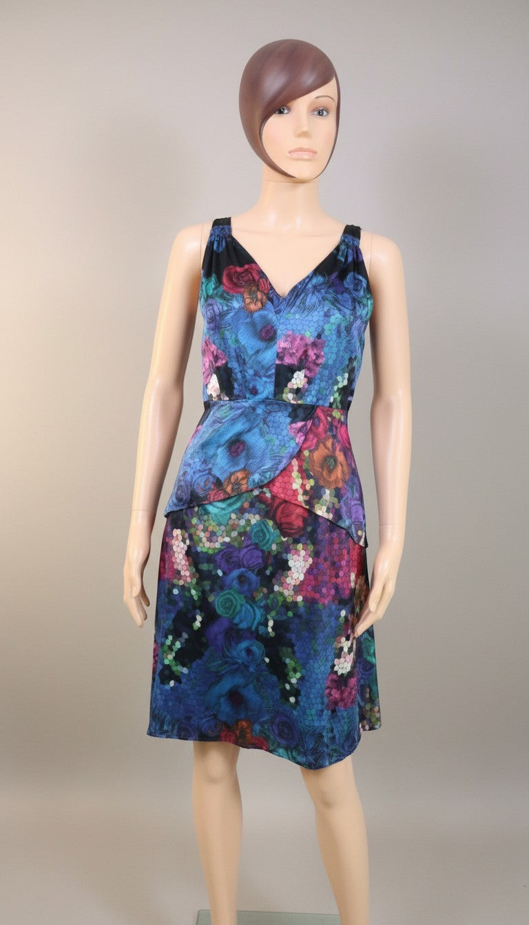 Frippindealz Chine Belgian Design silk dress with vibrant floral print in blue and multicolor. V-neck, sleeveless, and flowing.
