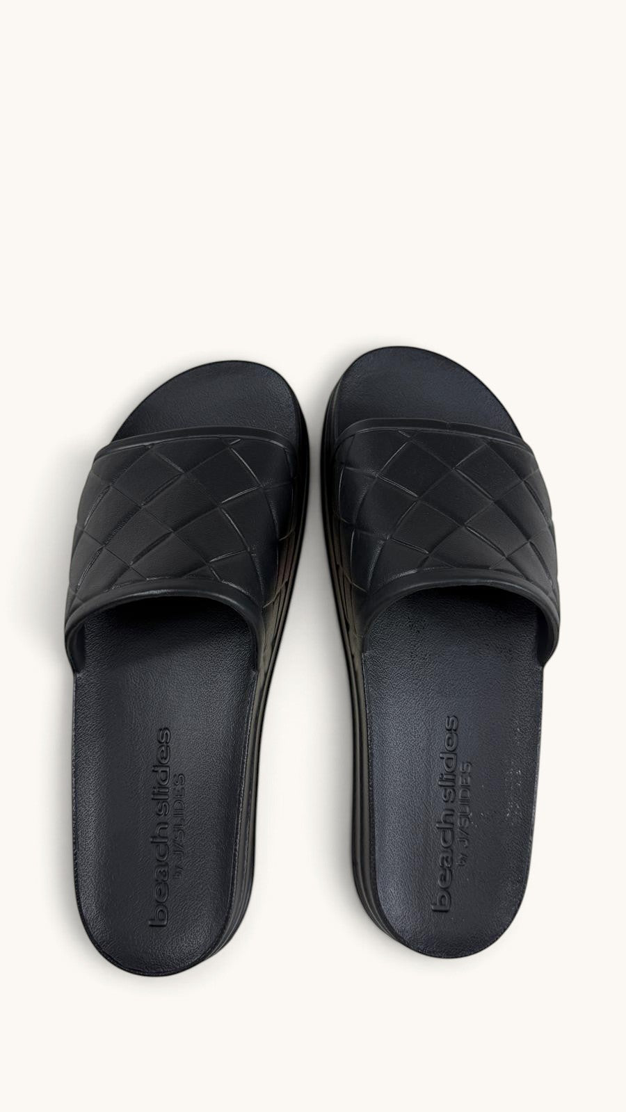 Claquettes Frippindealz J/Slides noires à bride matelassée et semelle plateforme en synthétique imperméable