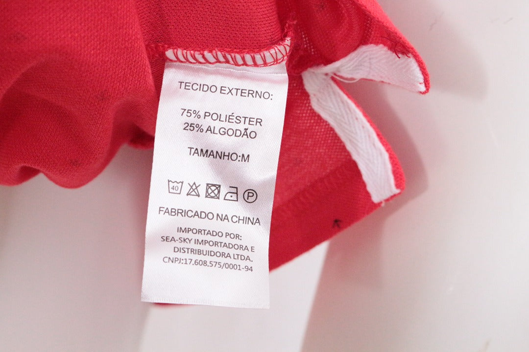 Étiquette de composition intérieure du polo Frippindealz Colombo rouge en mélange polyester et coton taille M