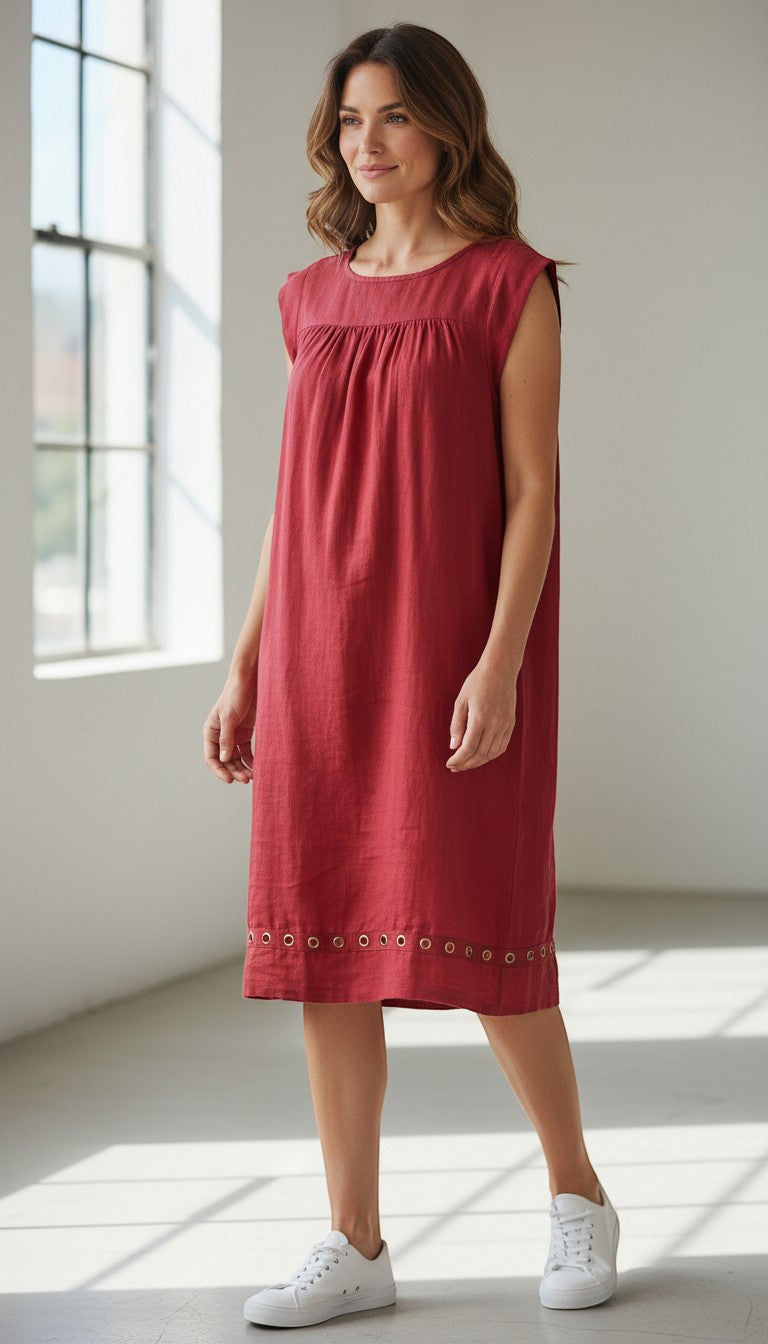 Frippindealz coral linen midi dress with gathered neckline and grommet hem detail.