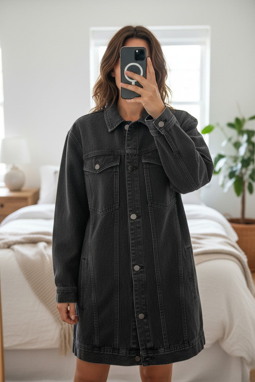 Frippindealz dark grey denim jacket dress with button closure and chest pockets. Features a classic collar and a subtle logo detail on the left chest.