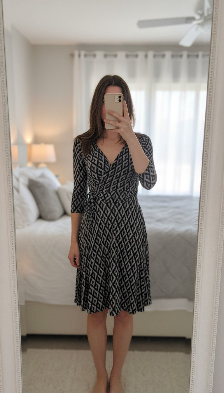 Frippindealz Lolaliza black and white geometric print polyester midi wrap dress with 3/4 sleeves.