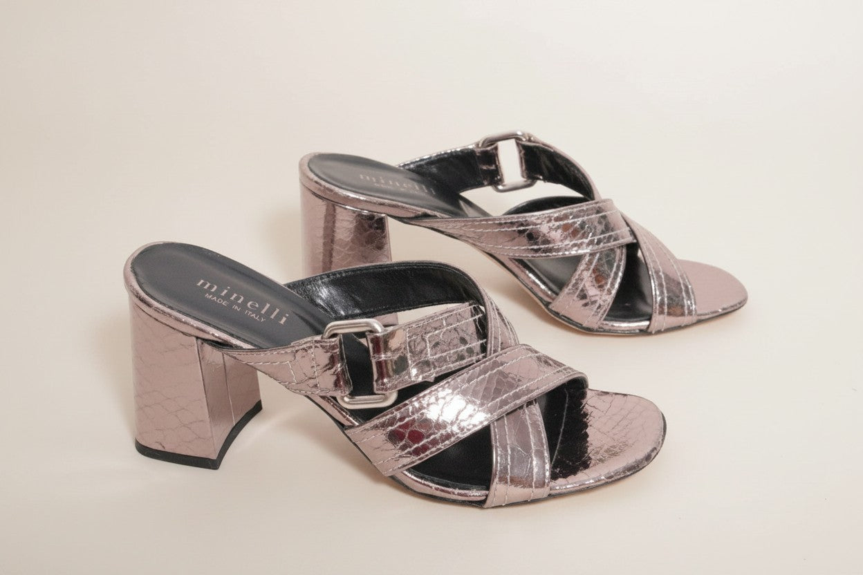 Frippindealz Minelli silver leather mules with criss-cross straps and buckle detail on a block heel.