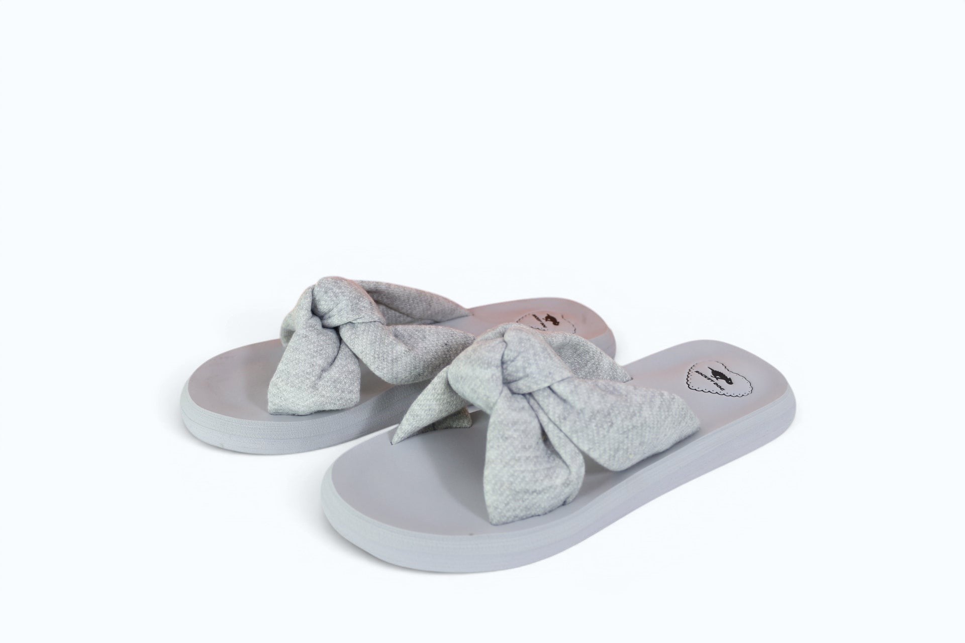 Mules femme Frippindealz Rocket Dog en textile gris chiné avec large nœud décoratif, style estival et confortable.