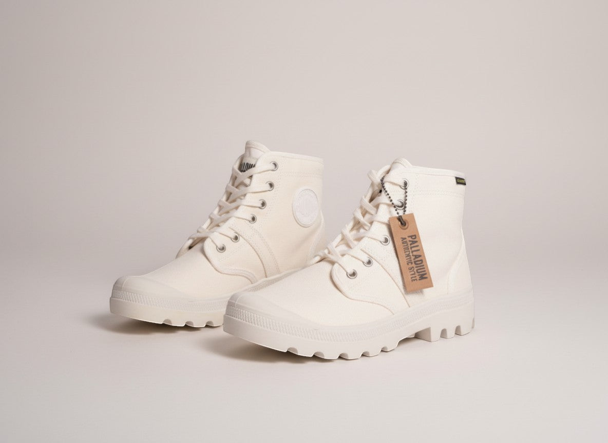 Frippindealz Palladium white cotton lace-up ankle boots with lug sole and logo detail.