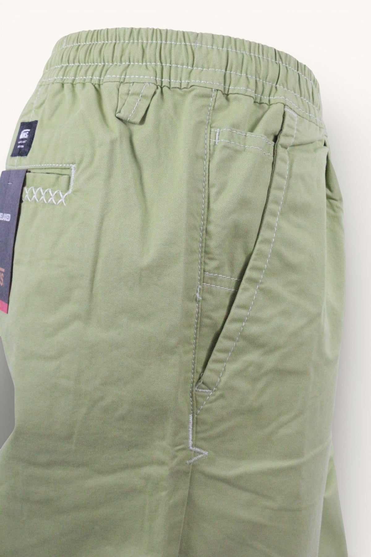Pantalon vert Frippindealz de marque Vans en coton et polyester avec taille élastiquée et coutures contrastantes