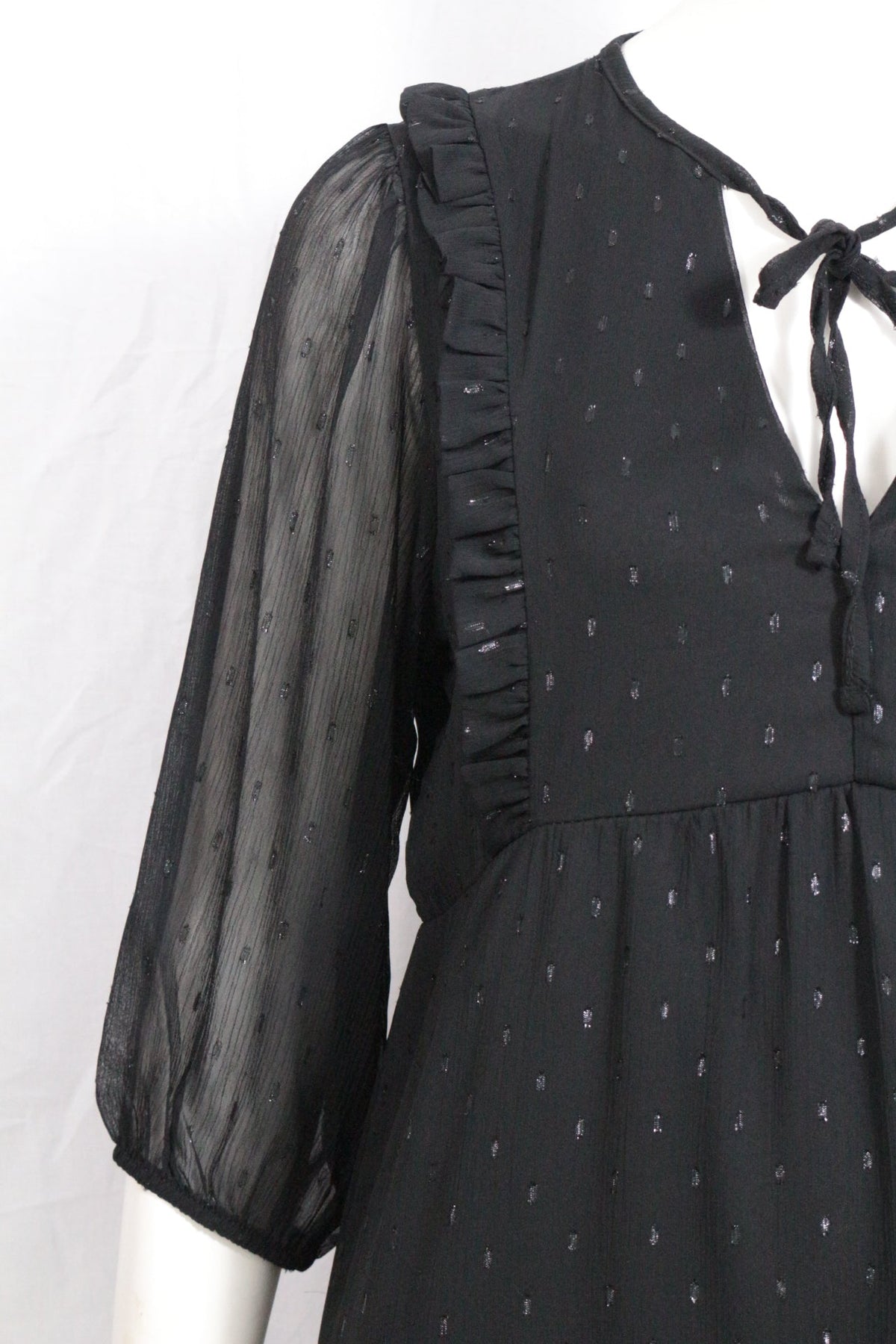 Robe mi-longue noire Frippindealz en polyester avec manches transparentes, volants et détail de nœud au col.