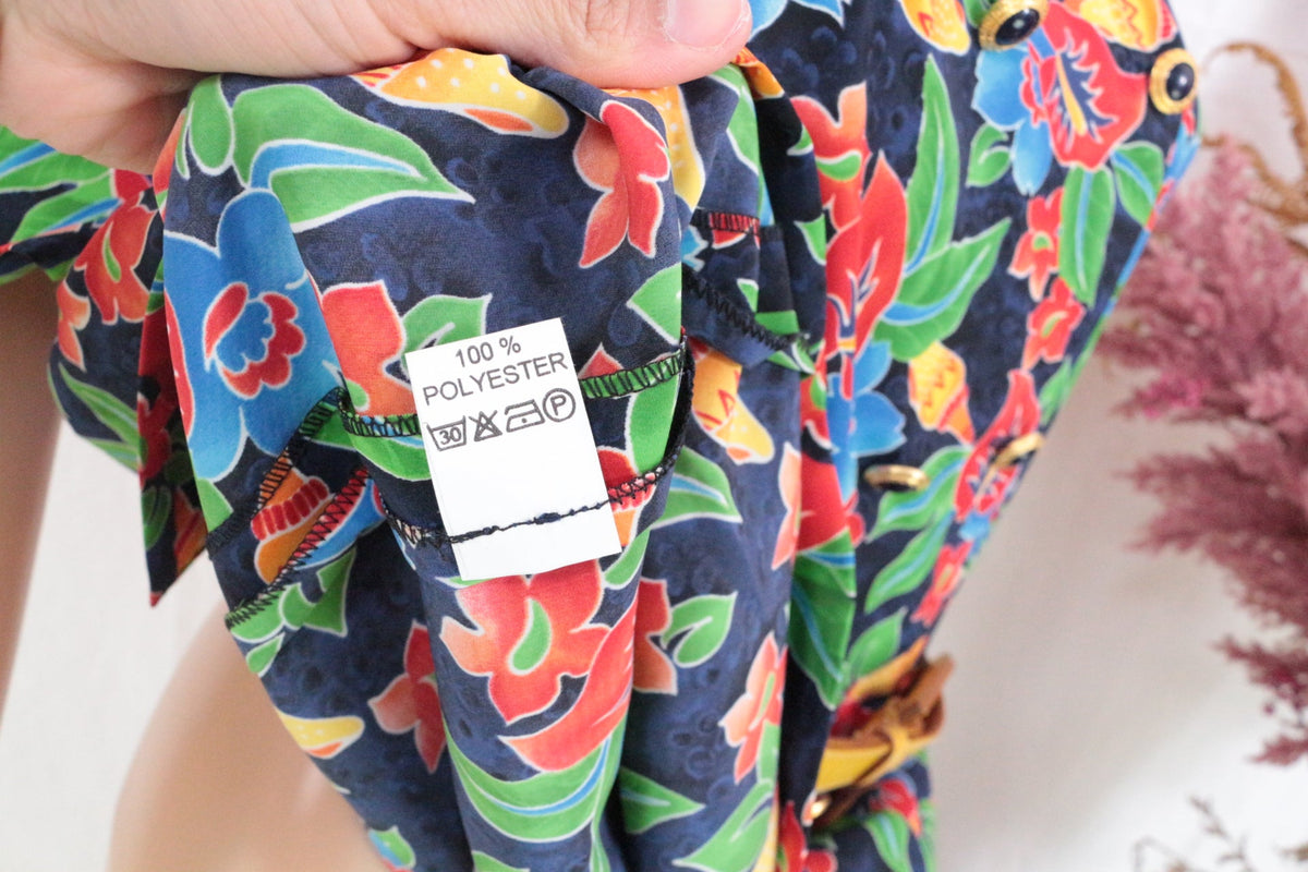 Étiquette de composition 100% polyester sur robe Coutureine multicolore à motif floral vendue par Frippindealz