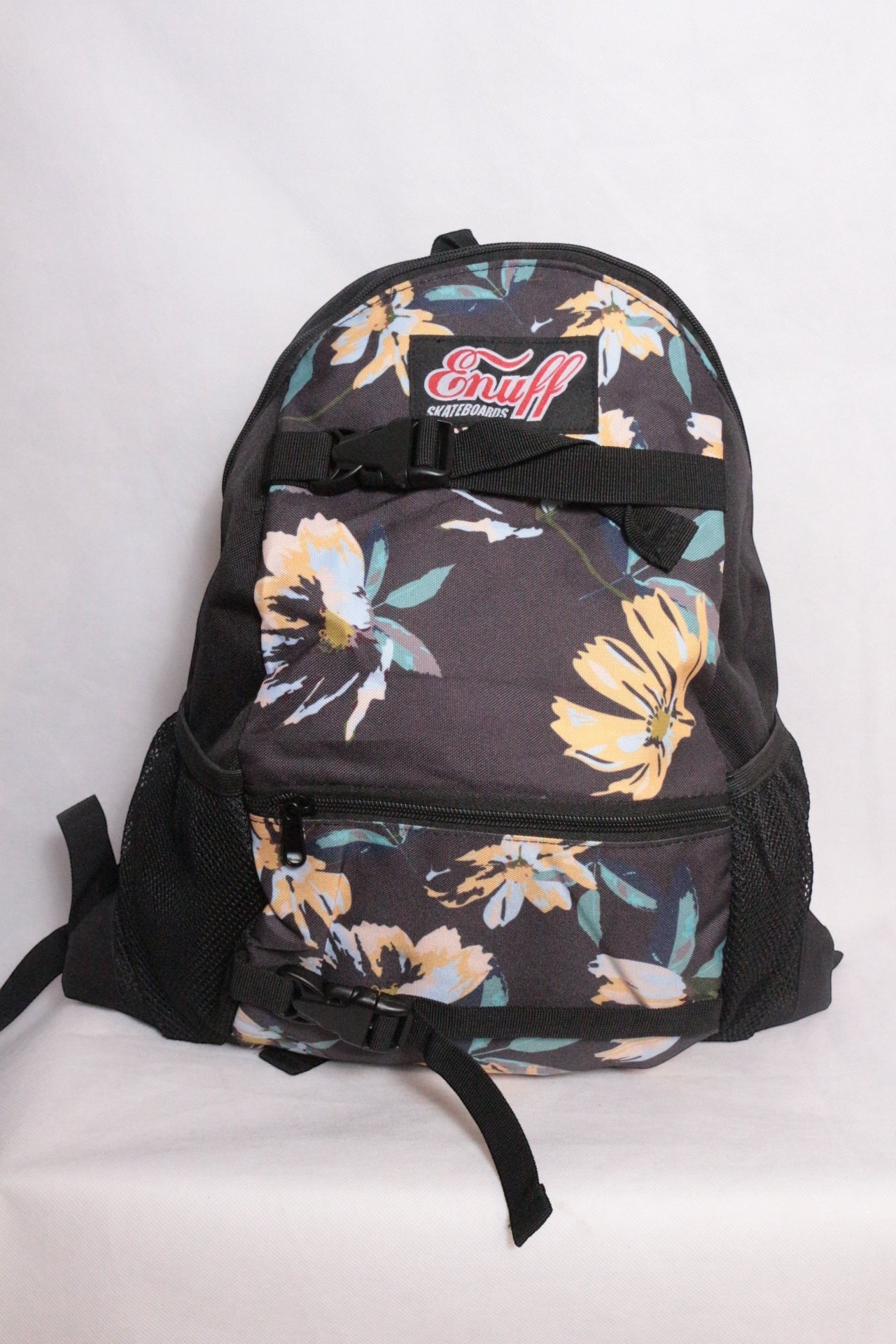Sac à dos Enuff Skateboards noir avec motif floral jaune et bleu, polyester, neuf