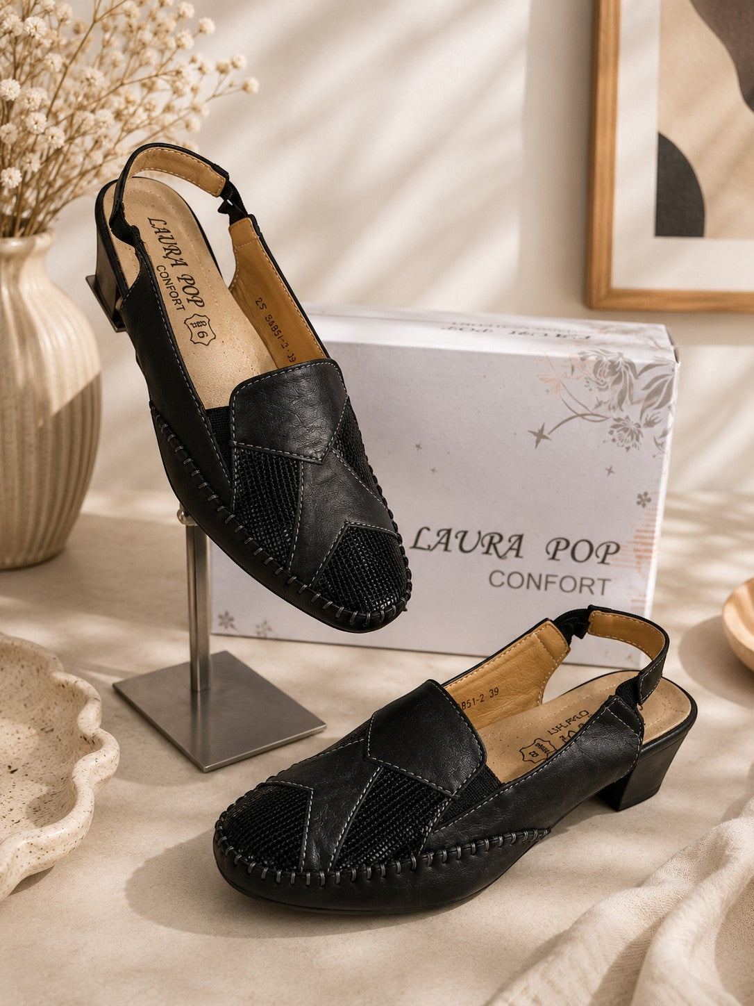 Sandales à talons Frippindealz LIBRA POP en cuir noir avec bride élastique et coutures apparentes, présentées en boîte