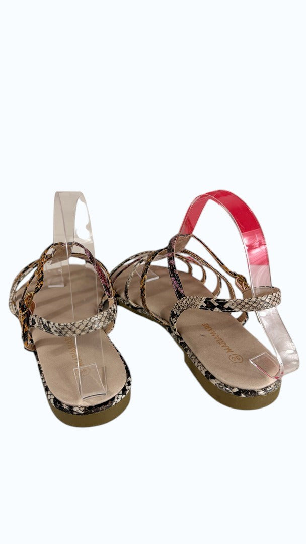Sandales plates Frippindealz Mariamare à fines lanières entrelacées, motif python multicolore et bride réglable.