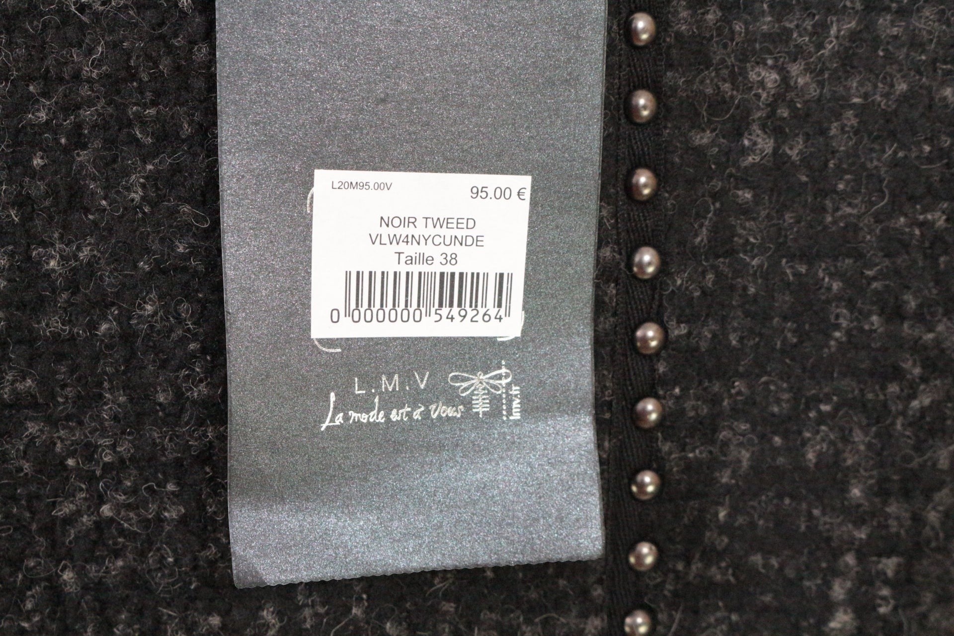 Veste biker Frippindealz en tweed noir texturé et simili cuir, zip asymétrique, clous métalliques, manches matelassées.