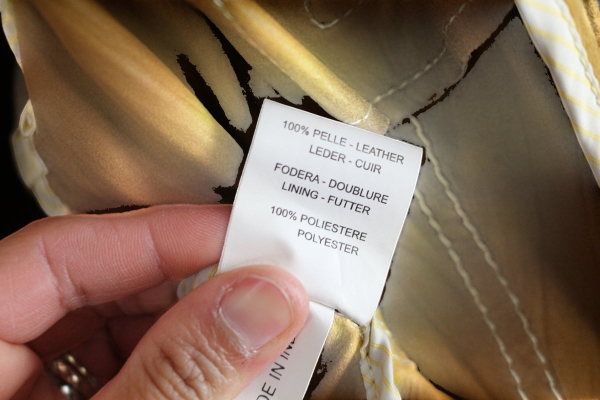 Veste en cuir camel Milestone taille M, doublure polyester, coutures apparentes et poches audacieuses. État : très bon.