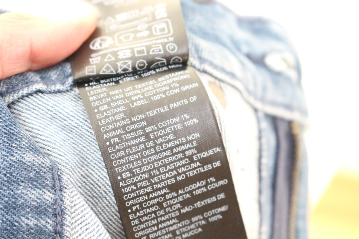 Étiquette de composition du jean G-Star Raw : 99 % coton, 1 % élasthanne – Frippin'Dealz