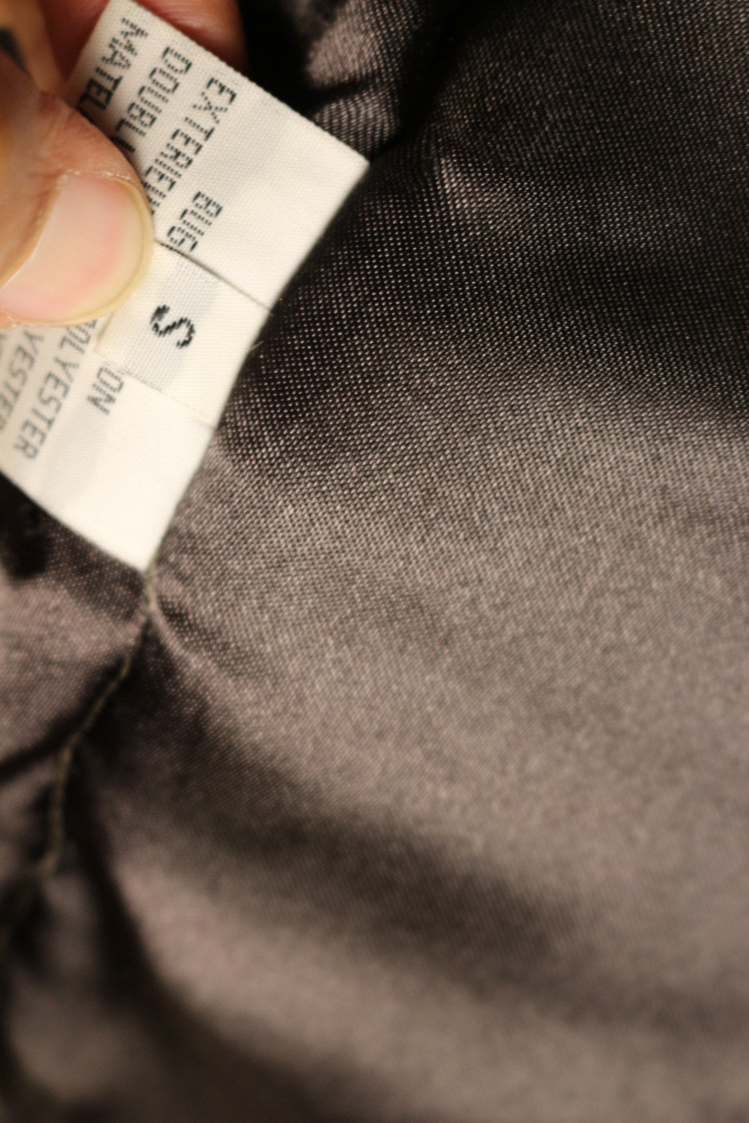 Étiquette de taille S du manteau Laurent Cerrer – Frippin'Dealz