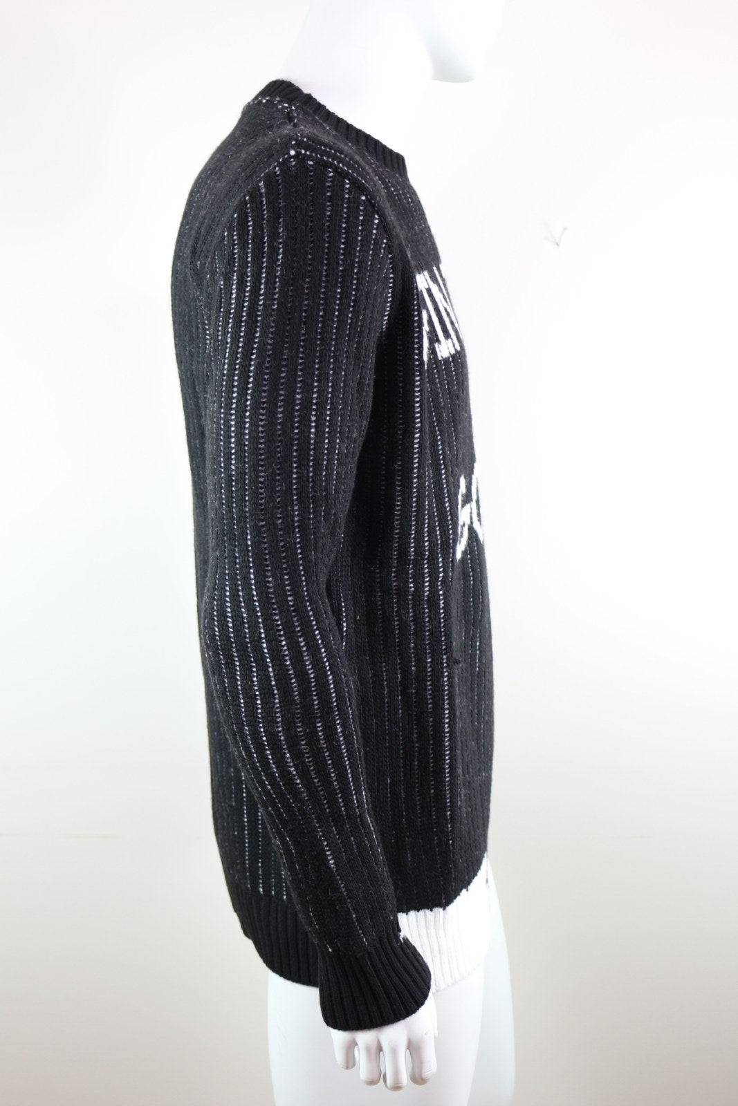 Pull Millions Man noir vu de profil, manche longue et bas côtelé blanc – Frippin'Dealz